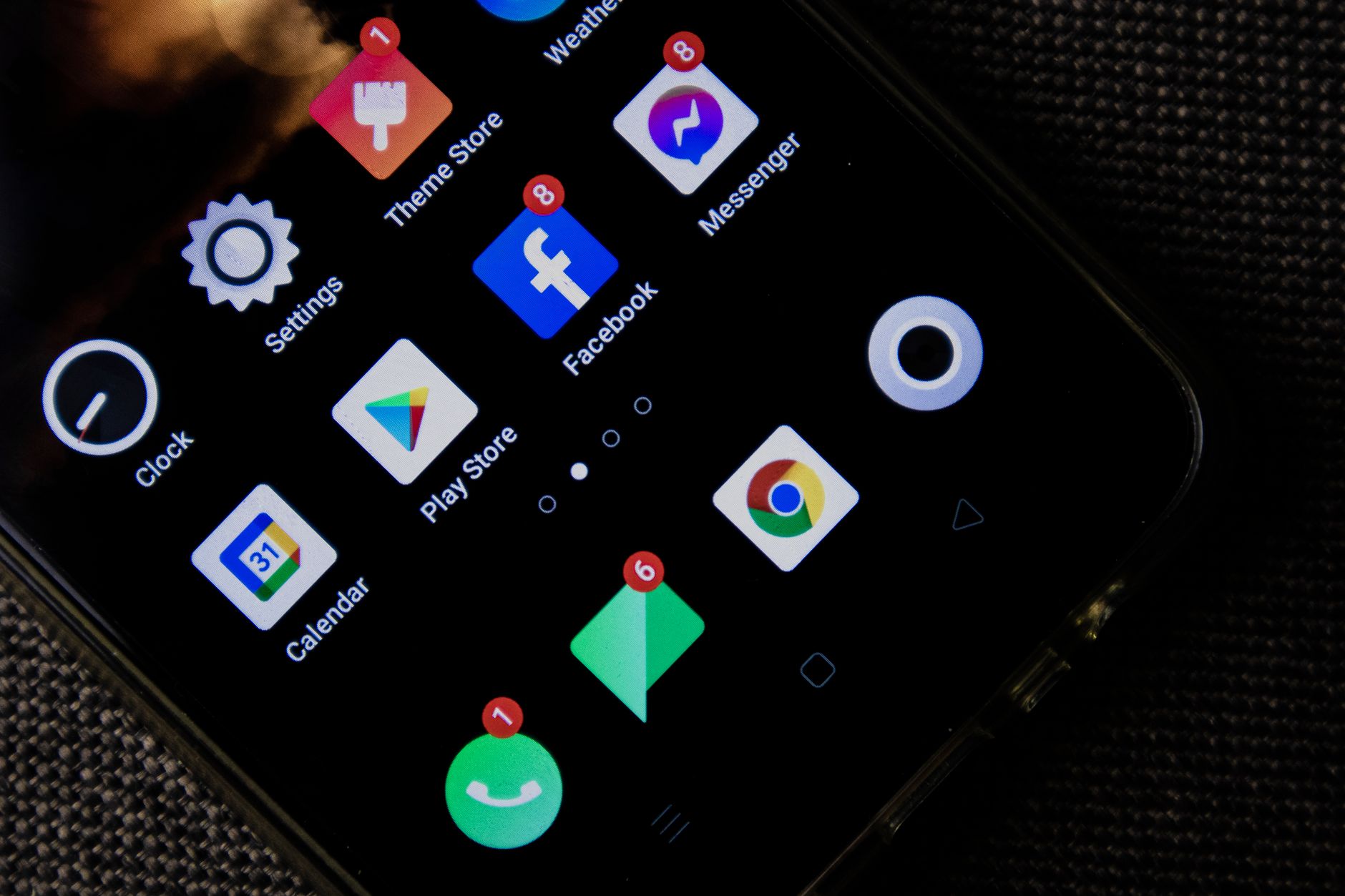 A smartphone home screen showing a stripped-down, minimal app layout with few icons