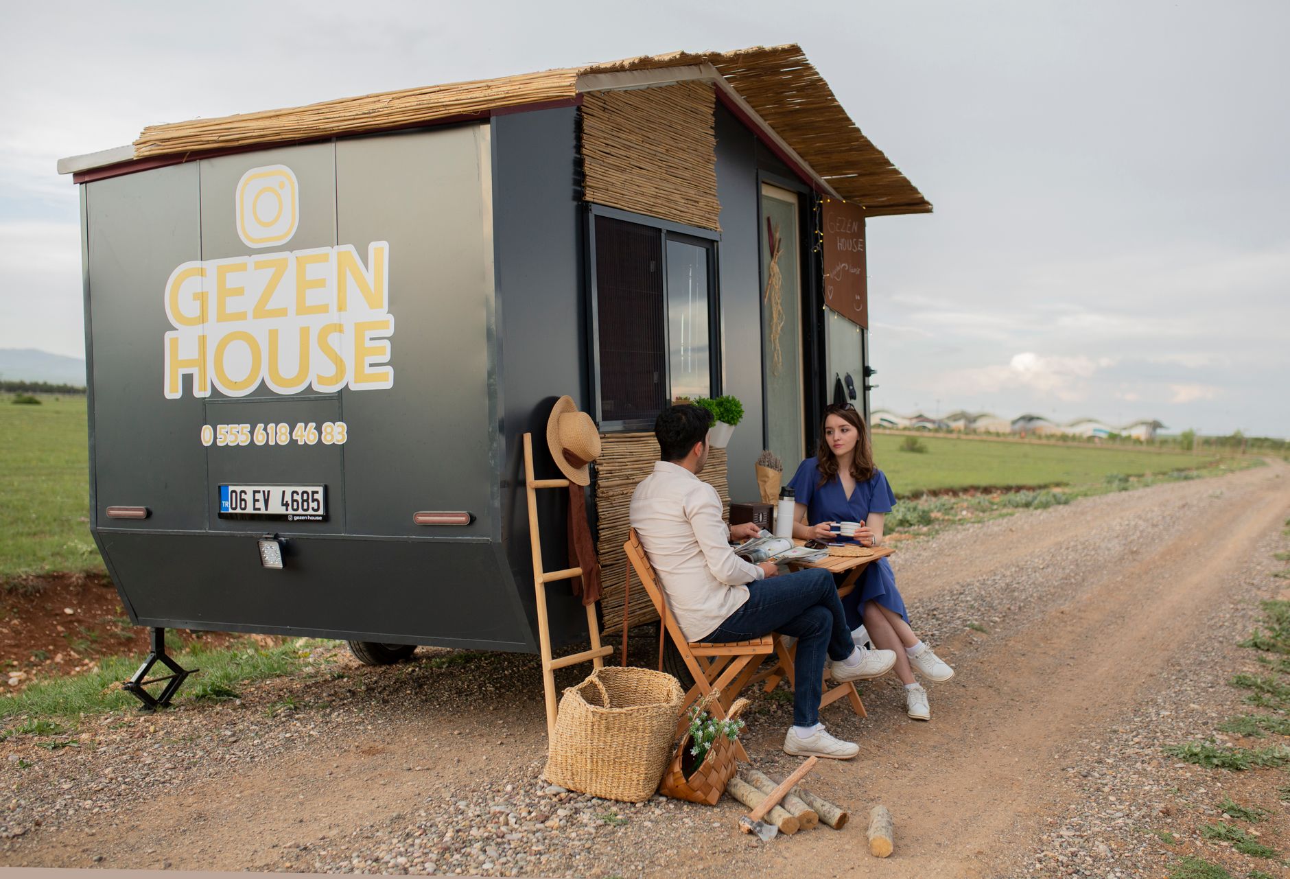 A small, modern tiny house surrounded by nature