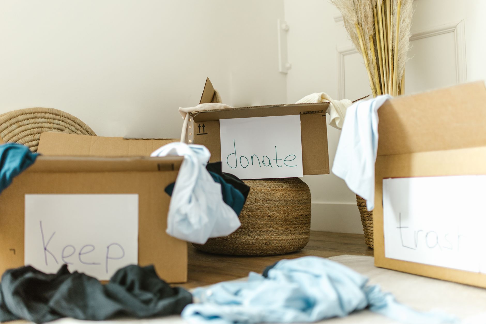 Organized closet with clothes and storage bins